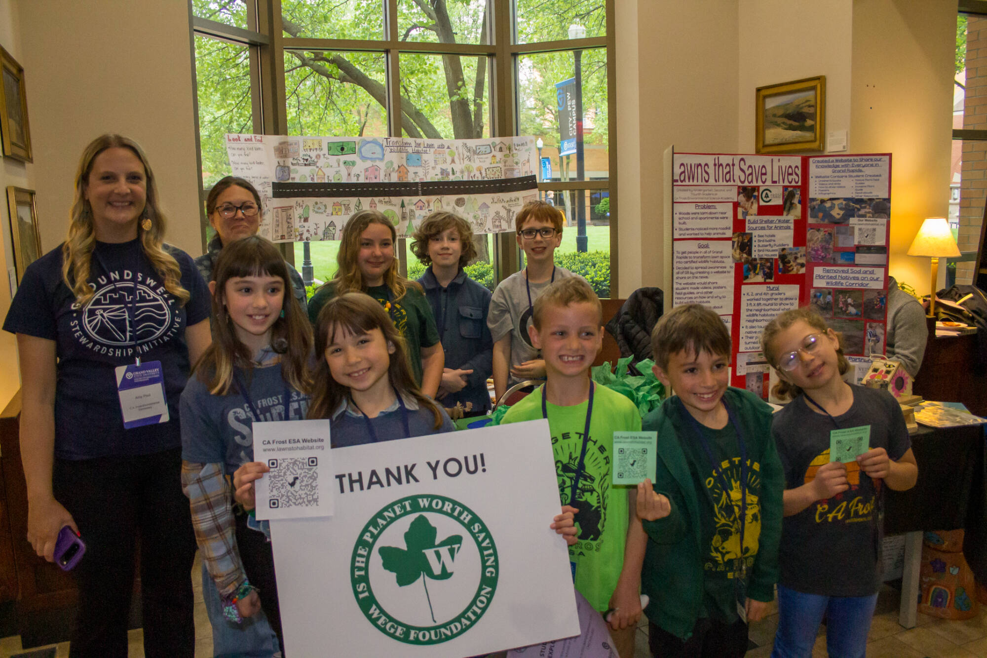 Group of Students Posing with WEGE Foundation Thank You Sign